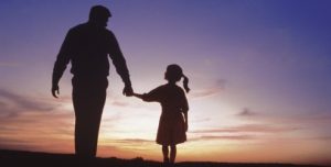 father-and-daughter-walking-at-sunset-494x250
